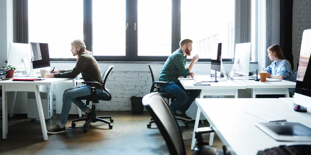 Employees working in open-plan workspace