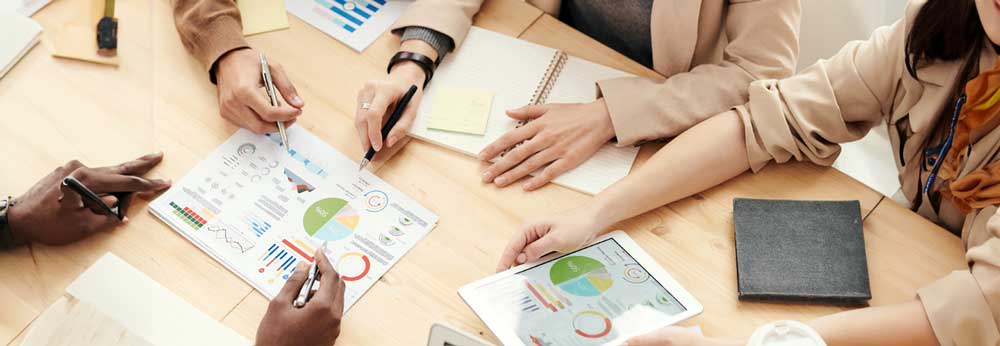 Table of employees discussing company KPIs