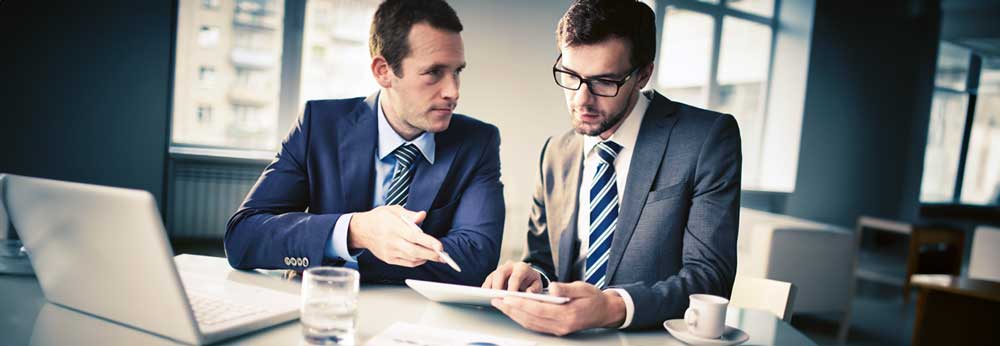 Two managers reviewing a data report