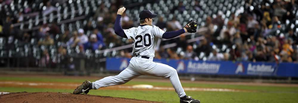 Baseball player throwing a pitch