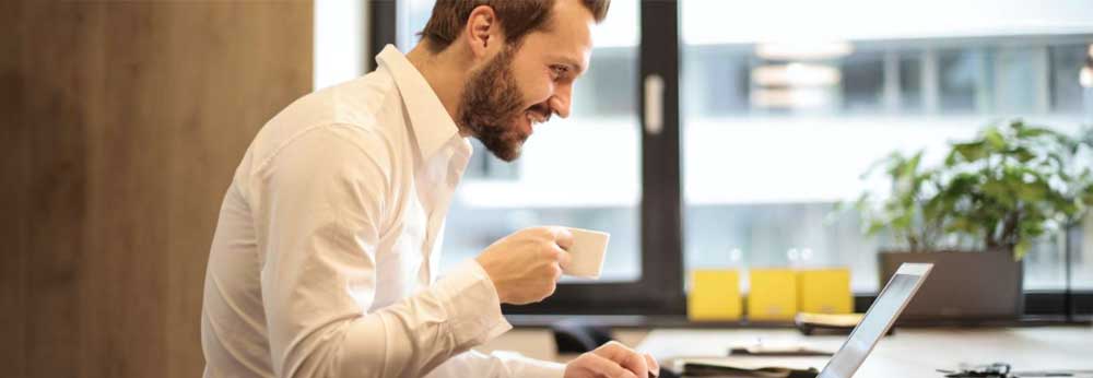 Male employee working in a remote shared work space