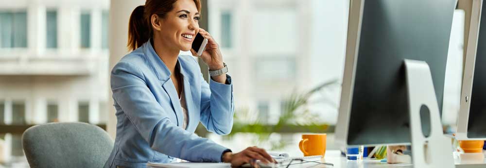 Manager making a phone call on her desk