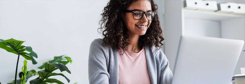 Employee looking at productivity data on her laptop