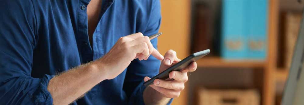 Employee engaged in work activities using his cell phone